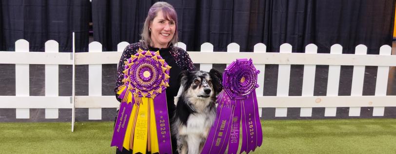 2025 Westminster Masters Obedience champion, Willie, with his owner after winning.