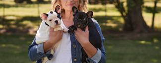 Woman holding two puppies - Cleft Palate